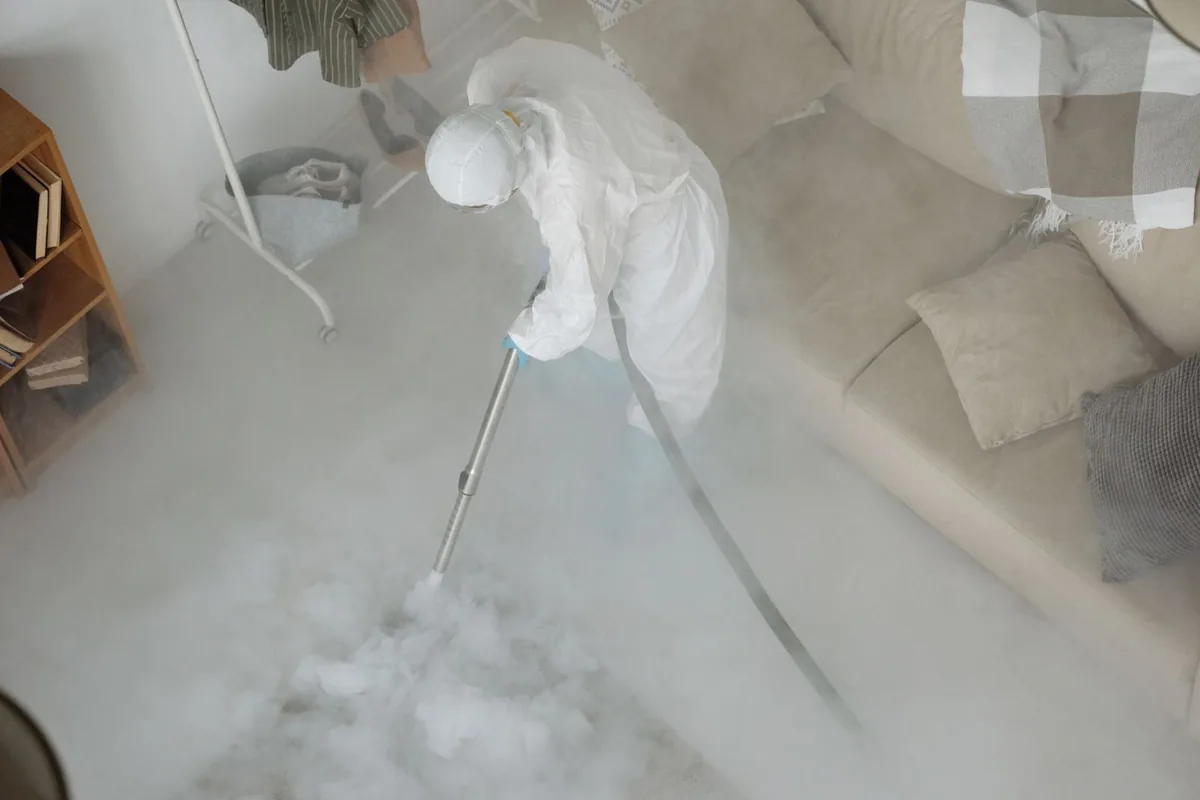 Biohazard cleanup technician in protective equipment, Farwell, TX